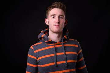 Face of young handsome man with hoodie