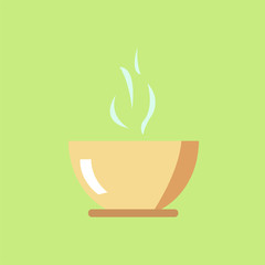 cup with hot drink on a green background