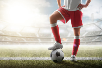 Soccer closeup. Leg of soccer player on the ball. Soccer background. Day stadium. Sport - obrazy, fototapety, plakaty
