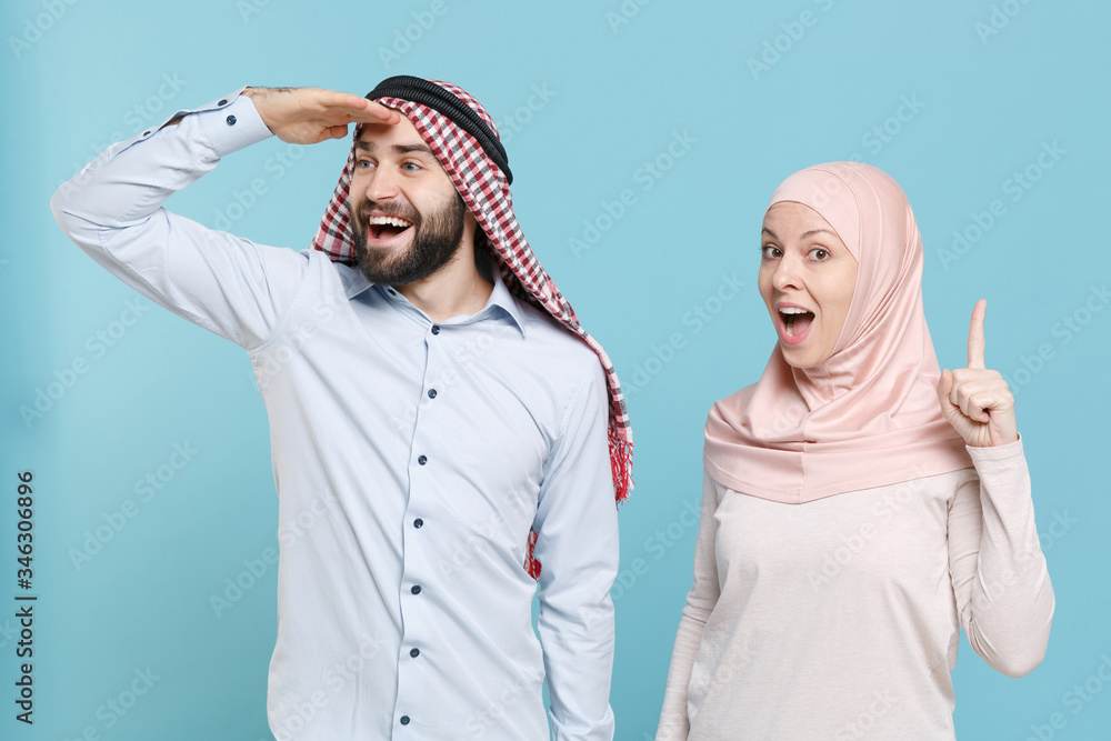 Wall mural couple friends arabian muslim man wonam in keffiyeh kafiya ring igal agal hijab clothes isolated on 