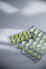 Packaging of green medicines in the shade and in the sun.