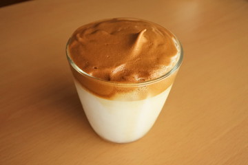 a cup of coffee drink, Dalgona coffee  - milk and formed coffee