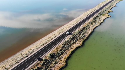 Aerial view of rv driving on Antelope Island Rd, Great Salt Lake, Utah, USA