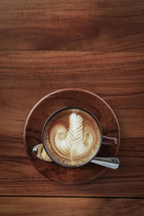 A cup of coffee with latte art on top