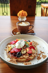 Pancakes with banana, kiwi, strawberries and ice cream