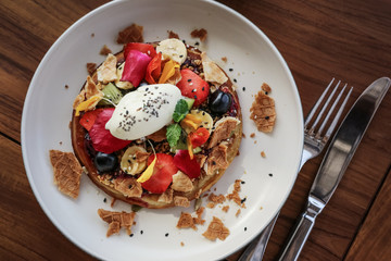 Pancakes with banana, kiwi, strawberries and ice cream