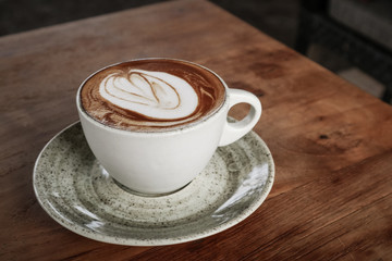 A cup of coffee with latte art on top