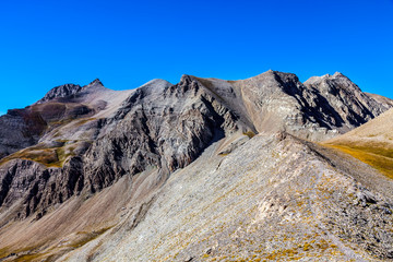 Image of a high altitude footpath in rocky mountains in the Southern French Alps.