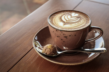 A cup of coffee with latte art on top