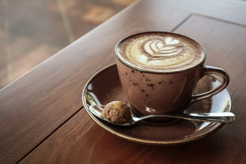 A cup of coffee with latte art on top