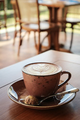 A cup of coffee with latte art on top