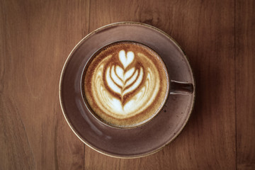 A cup of coffee with latte art on top