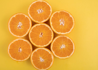 Orange on an orange background. Halves of juicy orange.