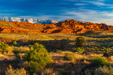 The Sun Illuminates the Red Cliffs and Pine Valley Mountain
