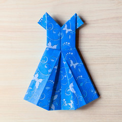 Origami made blue dress from butterfly printed paper. Mother's day, birhday, summer gift, fashion card. Family leisure time concept and game. Step by step instruction. DIY tutorial, flatlay, top view