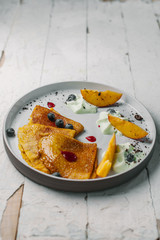 pancakes with sauce and fruit