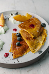 pancakes with sauce and fruit
