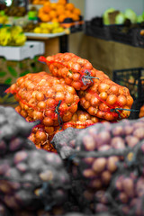 Potatoes In Net Bags At The Farmers Market.