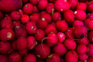 A close-up of radishes for sale on a mark