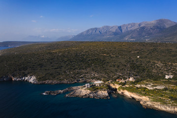 Obraz premium Aerial birds eye view photo taken by drone of fishing village of Mezapos with blue clear waters, Mani, Laconia, Peloponnese, Greece