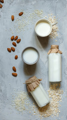 natural vegetable milk in bottles on a stone background, on top