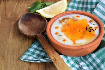 
Bounty soup with tomato sauce in an earthenware dish