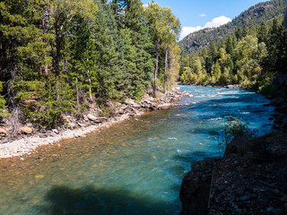 The Narrow Gauge Railway from Durango to Silverton that runs through the Rocky Mountains by the River Animas In Colorado USA