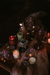 Still life of wedding decorations, candles and wine