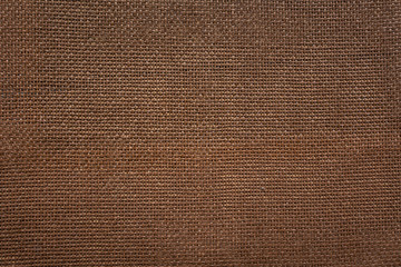 Background in brown color with a texture of thick linen canvas