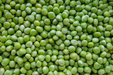 Background of young juicy green peeled peas