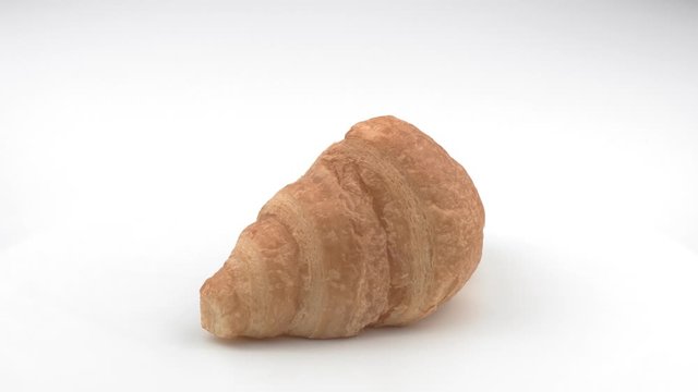 Croissant on white background closeup.