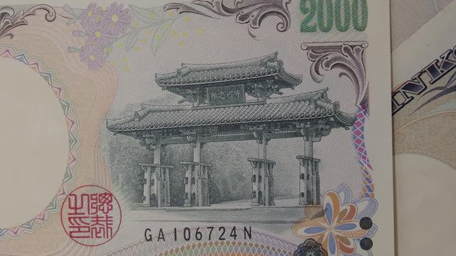 Banknotes of the 2000 Japanese yen currency, Close up, JPY. banknote rotating