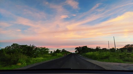 sunset over the road