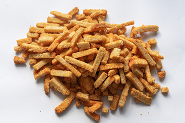 Long, golden breadcrumbs sprinkled with a slide