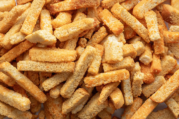 Background of golden long crackers lying on the mound