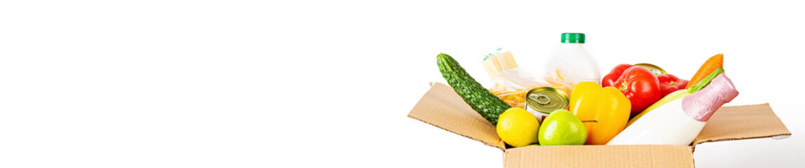 Donation box with various food isolated on white background with copy space. Mockup, web banner. Food donations or food delivery service concept. Online shopping during coronavirus covid-19 lockdown