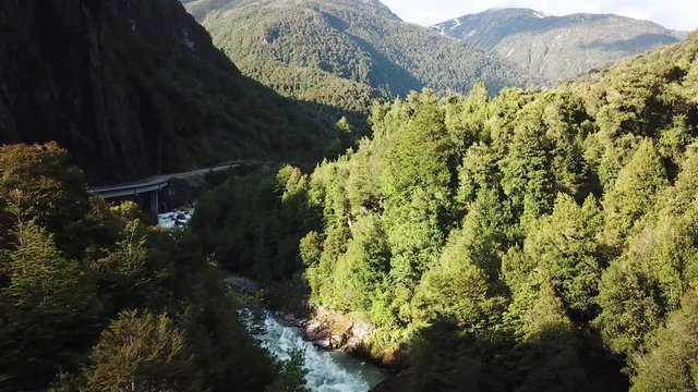 Drone Aerial View of Chilean Landscape in Patagonia. Road and River Canyon Under Evening Sun