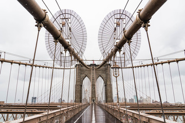Naklejka premium Brooklyn bridge. Rainy Brooklyn bridge view. Brooklyn bridge close up view. Rainy day at Brooklyn bridge. 