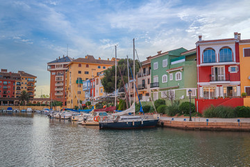 Fototapeta na wymiar small Citi with big canal and lot of boats close to houses , look like Venice , Port Saplaya ,Alaboraya, Spain 