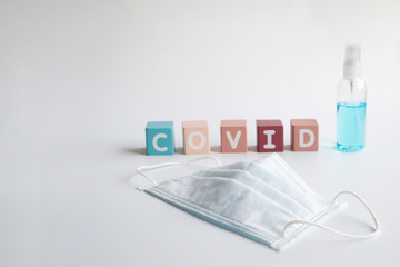 Covid-19 protection by wearing face mask and using alcohol hand sanitizer. Healthcare and new...