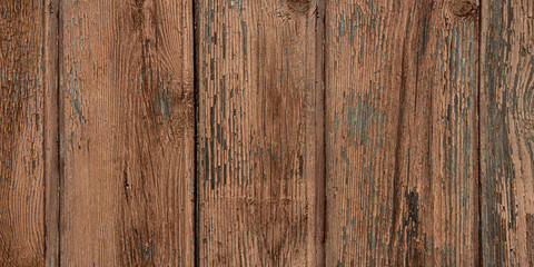 Old shabby and rural wooden texture with peeling brown and beige paint. Hardwood with scratch and peels. Old shabby fence.