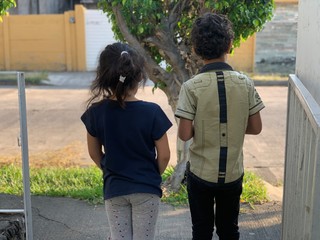 rear view of a young couple walking