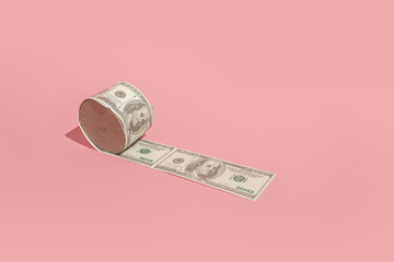 Minimal concept of the economic crisis of 2020, monetary inflation during the coronavirus. The photo shows dollars and toilet paper.