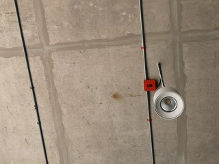 luminaire installed inside the building with a concrete surface ceiling