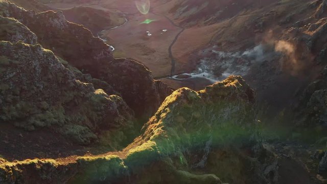 Aerial of Moutain Rock Spine with Volcano Fumarole and Thermal Water Stream below at Sunset Sunrise - Ulysse Tassin Winter Iceland Drone 21/38