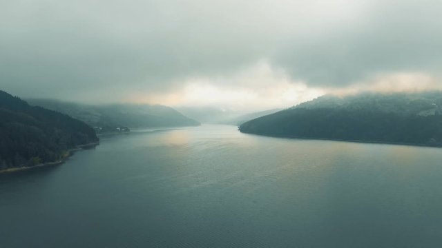 Izvorul Muntelui Reservoir - Flying over lake, between montains - Dolly in