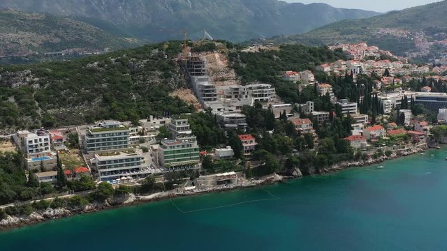 Hotels on Seashore in city of Dubrovnik Croatia - Aerial View of Hotel Complex revealing old City of Dubrovnik
