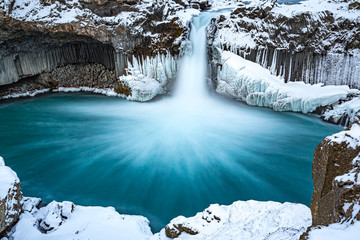 Soft, slow shutter creates blurry water at Aldeyjarfoss waterfall