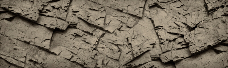 Old stone wall background. Rock texture. Light brown gray grunge background. Rocky texture banner with copy space for your design.