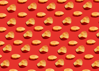 Pieces of potatoes and chips on a red background. Modern pattern